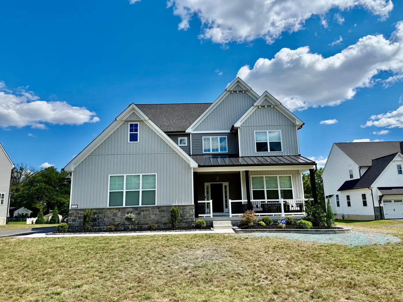 Craftsman home with fresh curb appeal landscaping