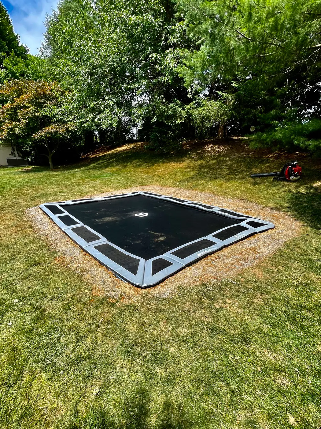 Inground trampoline, flush to the lawn