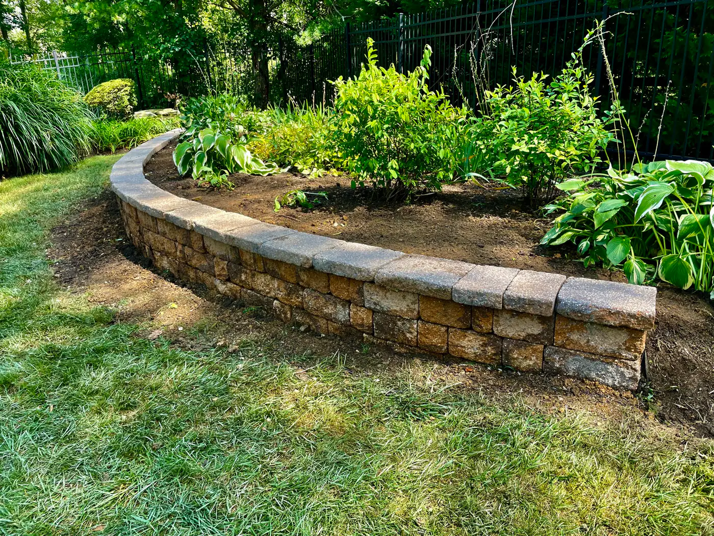 Curved segmental block seating wall